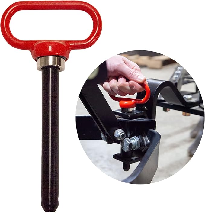 A red handle hitch pin and a circular inset showing a person inserting the pin into a hitch attachment on equipment. The handle is bright red and contrasts with the black metal of the machinery.
