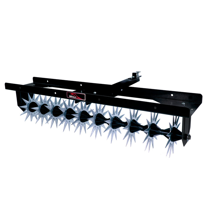 The Brinly Parts 40″ Tow-Behind Spike Aerator (SA2-40BH-G) features multiple silver spiked wheels and a wide channel tow bar, designed for effective lawn aeration when mounted to a lawn tractor.