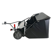 Side view of Brinly Parts 54 Lawn Sweeper LS2-54BH-G in black, showcasing its double-helix brushes, debris bag, and large wheels. This tow-behind model includes a tow bar for vehicle or tractor attachment, ideal for efficiently collecting grass clippings and leaves.