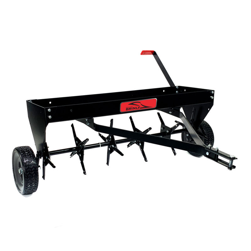 A black lawn aerator with spiked wheels and a metal handle. The machine features a red label in the center and two sturdy tires for mobility.
