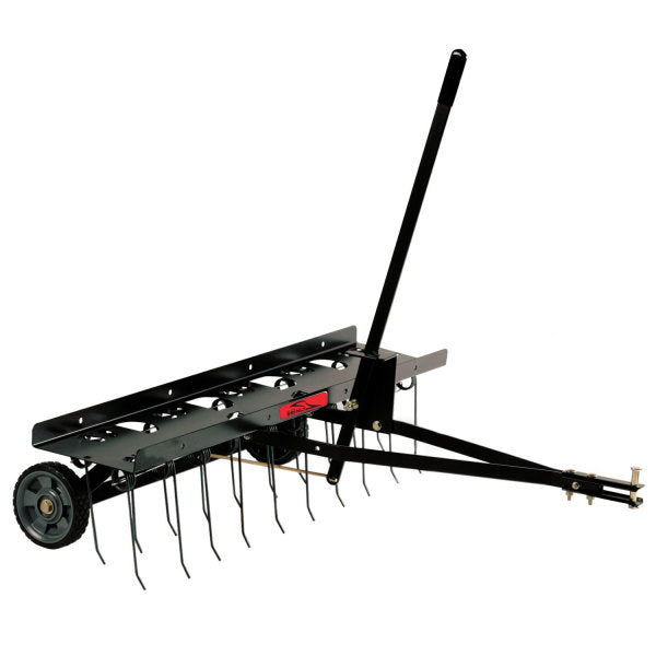 Black metal tow-behind lawn dethatcher with wheels, a long handle, and multiple curved tines for removing thatch from grass.