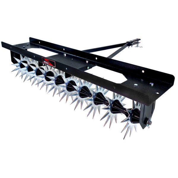 A black metal tow-behind lawn aerator with multiple rows of silver spiked wheels, used for aerating soil.