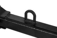 Close-up of the Brinly Parts Universal ATV/UTV One-Point Lift (OPL2-BH), featuring a welded, upright U-shaped loop on a black metal bar, designed for Brinly Ground Engaging Products, shown against a white background.