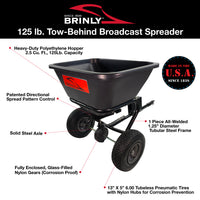 Image of the 125 Lb. Tow-Behind Broadcast Spreader | BS26BH by Brinly Parts featuring a rust-proof polyethylene hopper, 2.5 cu. ft. capacity, directional spread pattern control, solid steel axle, and 13 x 5 tires—ideal for efficient lawn fertilization. Made in the USA since 1839.