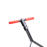 A close-up of the Brinly Parts 28 Gallon Push or Tow Poly Lawn Roller (PRC-243BH) shows a metal handlebar with bright red grips and visible bolts on its black frame, set against a white background.