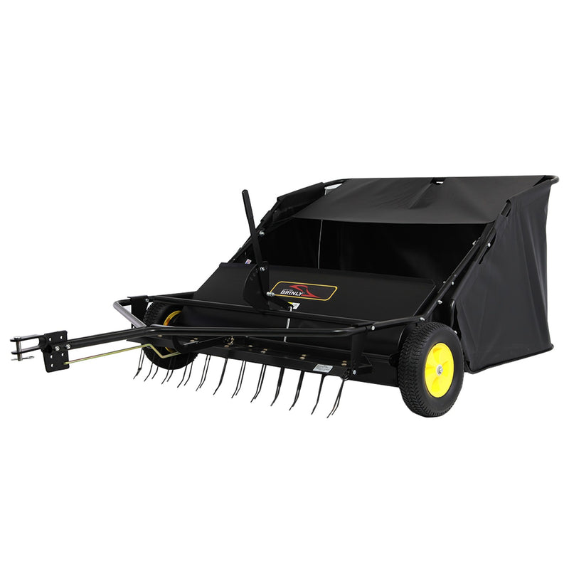 The Brinly Parts 42″ Lawn Sweeper with Dethatcher (STS-42BHDK-A) features a black design with yellow wheels, a large fabric bag, pull handle, and metal tines. It hitches to lawn tractors for efficient sweeping and dethatching.