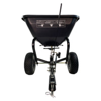 The Brinly Parts 125 Lb. Tow-Behind Broadcast Spreader (BS26BH) is black, with a rust-proof polyethylene hopper, two large wheels, and a metal hitch for easy tractor attachment. It’s perfect for evenly spreading seeds, fertilizer, or other materials during lawn fertilization.