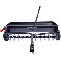 The Brinly Parts 40 Combination Aerator Spreader (AS2-40BH-G) features pneumatic tires, a rectangular tray, spiked drum, and red handle lever. It includes a 100 lb. capacity hopper for spreading materials as you tow it with your ride-on mower or tractor to enhance lawn care.