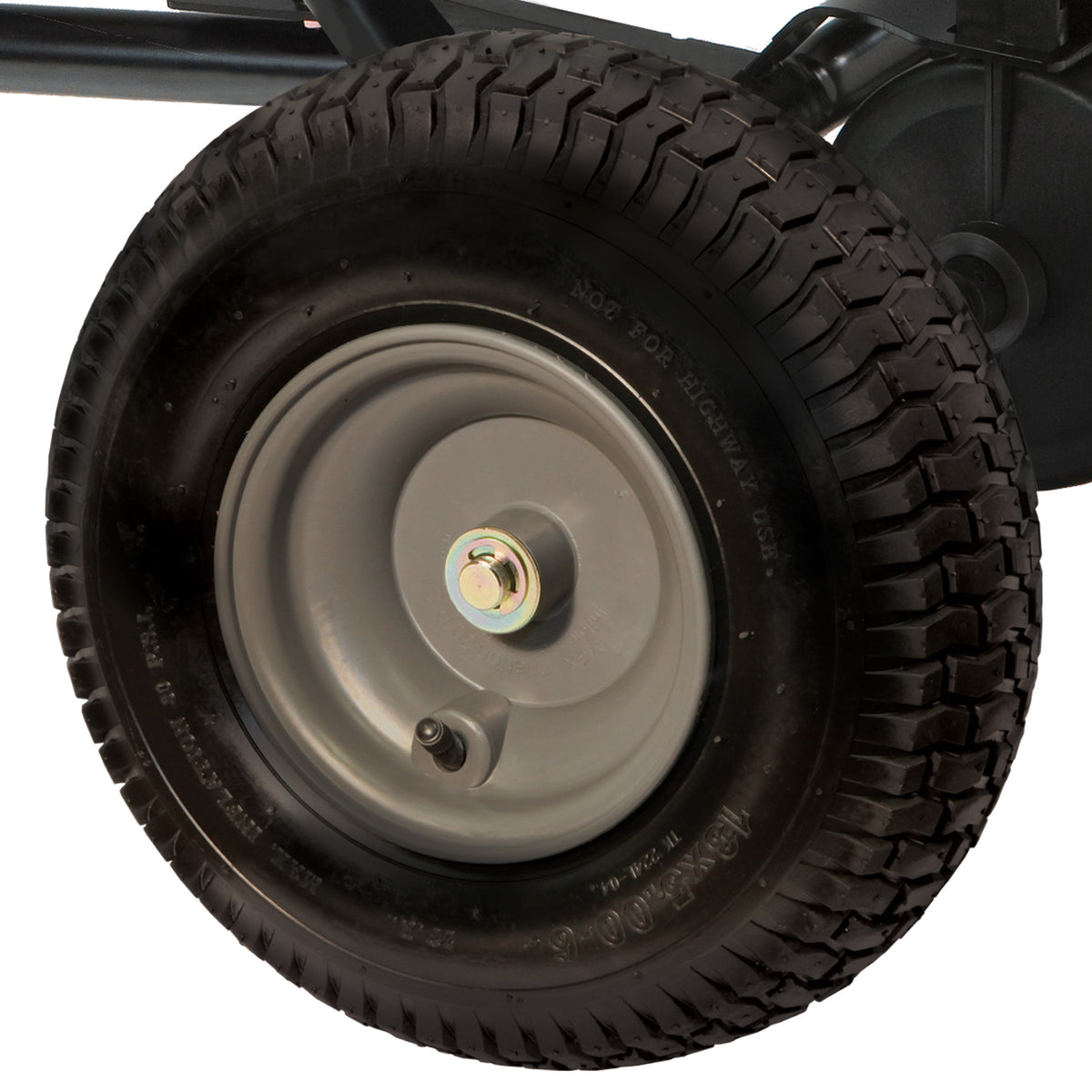 The Brinly Parts 175 Lb. Tow-Behind Spreader (BS36BH) features a close-up of a black rubber tire with textured tread, the words NOT FOR HIGHWAY USE, and is mounted on a rust-proof polyethylene rim with a central bolt and air valve, ideal for broadcast spreaders.