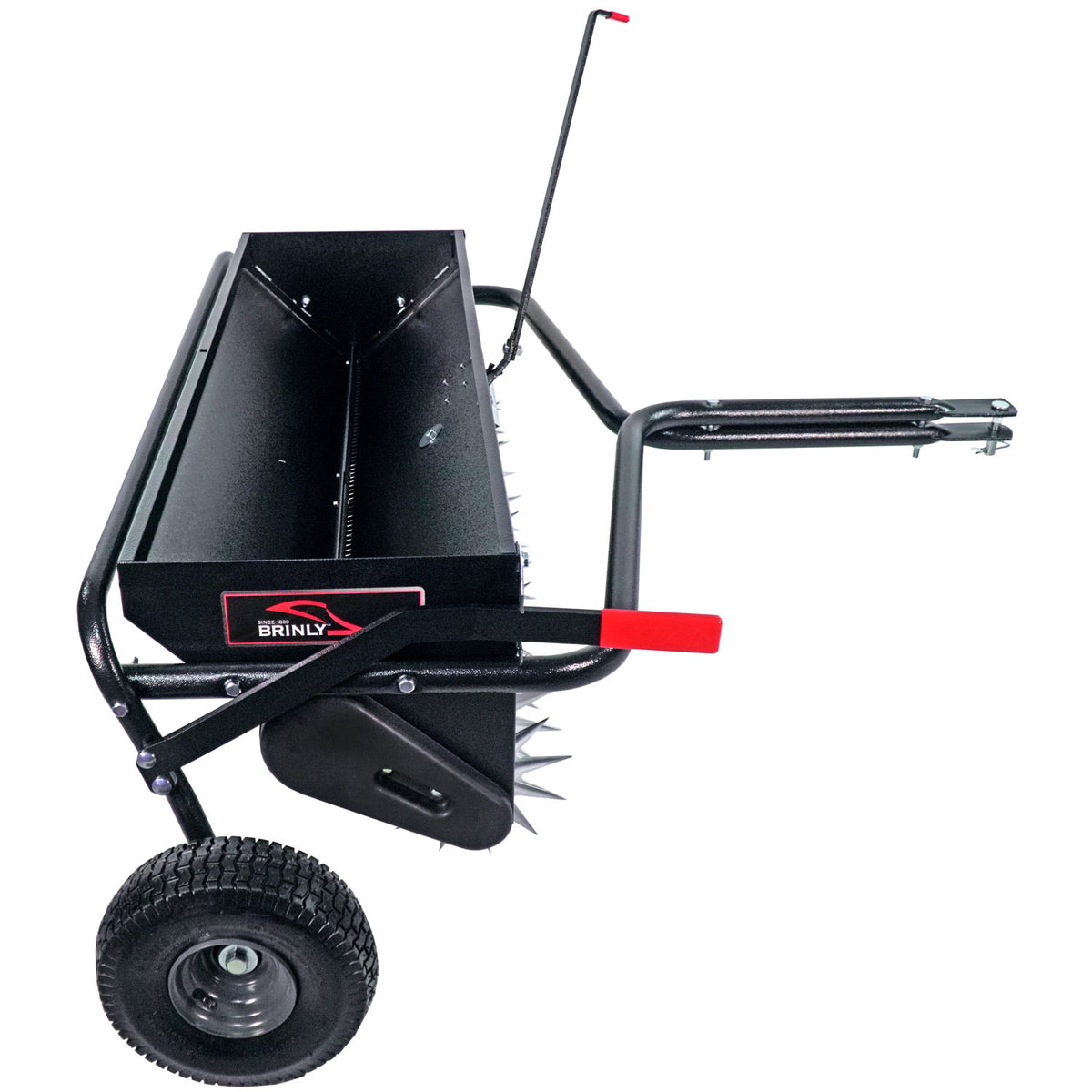 The Brinly Parts 40 Combination Aerator Spreader (AS2-40BH-G) features a black metal body, spiked roller, and side lever. It has two large pneumatic tires, a towing handle for easy use, a red accent near the branding, and comes with a 100 lb. capacity hopper for efficient operation.