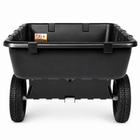 A front view of the Brinly Parts 10 Cu. Ft. Poly Cart (model PCT-101BH) shows its large, black container and two sturdy, textured rubber wheels. The deep utility cart features a warning label inside and is set against a plain white background.