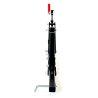 A black metal Universal ATV/UTV One-Point Lift from Brinly Parts stands vertically with several bolts, a red-handled lever on top, and a silver L-shaped Brinly Sleeve hitch support protruding from the bottom left.