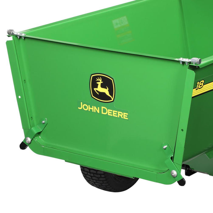 Close-up of the green John Deere 18 cu. ft. Steel Utility Cart (HDC-180JD/LPHDC18JD) featuring the yellow leaping deer logo. It has a bracketless tailgate and supports a 1,500 lb load limit, with a black wheel partially visible beneath it.