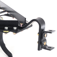 Close-up of the Brinly Parts Sleeve Hitch Cultivator CC-560s black metal mechanical assembly featuring visible bolts, brackets, screws, and joints. This structure includes curved and straight components reminiscent of a sturdy tow-behind cultivator design.