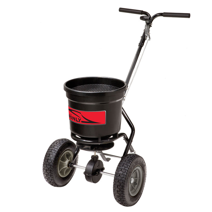 The Brinly Parts 50 lb. Push Spreader | P20-500BH is a sleek black and red spreader with a large hopper and two sturdy wheels, ideal for broadcasting lawn fertilizers or seeds. It features an ergonomic handle for easy maneuvering across lawns or gardens.