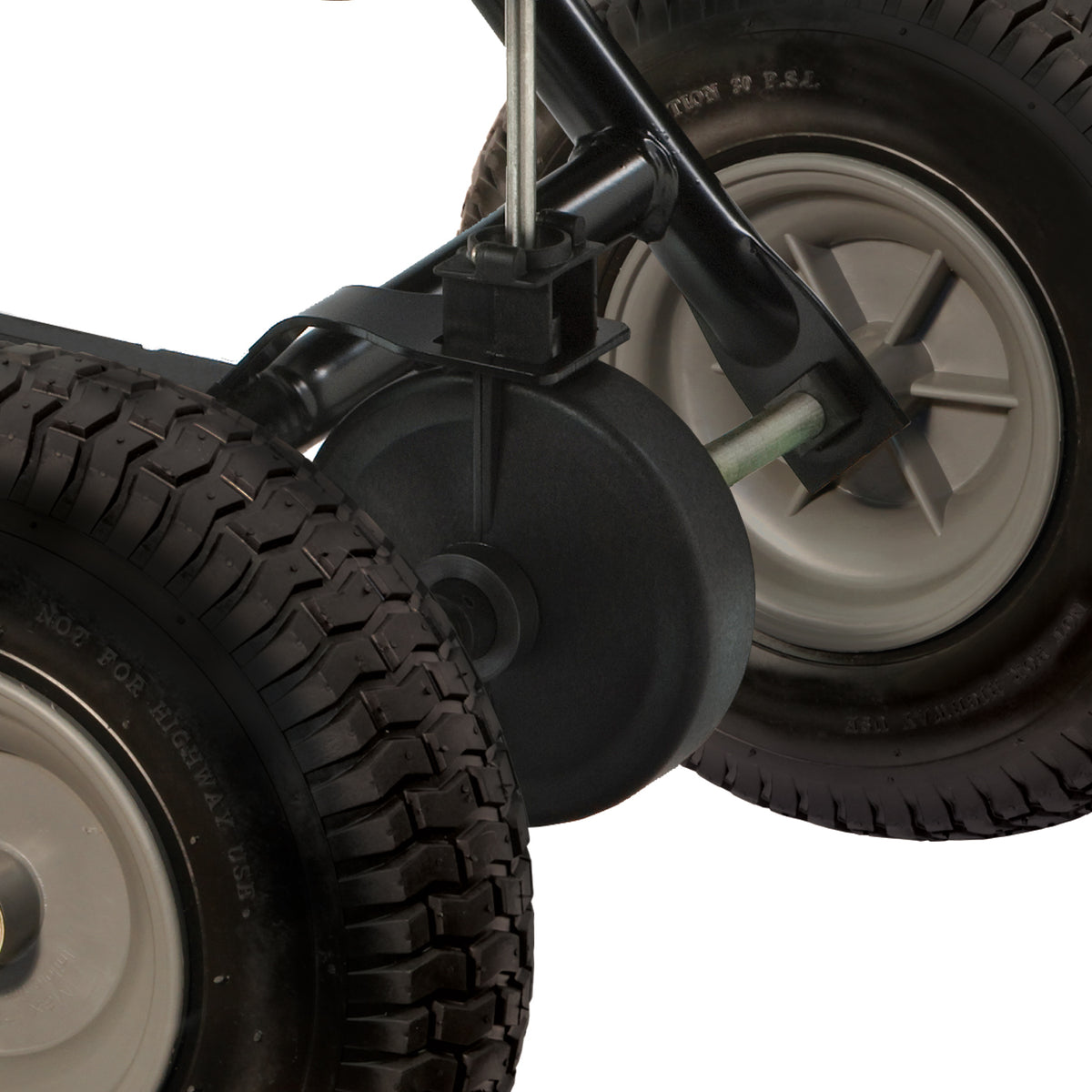 A close-up shows two rugged black wheels with thick treads attached to a rust-proof polyethylene axle, hinting at the durability of the Brinly Parts 175 Lb. Tow-Behind Spreader (BS36BH). A third wheel is partially visible on the left against a white background.