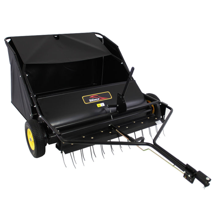 The Brinly Parts 42″ Lawn Sweeper with Dethatcher (STS-42BHDK-A) is a black 2-in-1 unit with yellow wheels, metal tines, large collection basket, and an easy-to-use handle for emptying debris.
