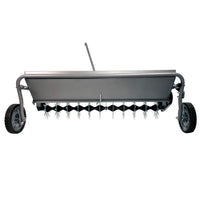 The 40 Combination Aerator Spreader by Brinly Parts in Hammered Gunmetal (AS2-40BH-S) features spiked tines, two side wheels, and a handle, efficiently aerating soil for better water absorption and healthier lawns.