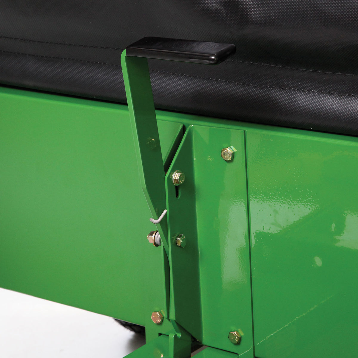 Close-up image of a green John Deere MC519 Material Collection System (LP49228) with a black handle and gold bolts. The handle connects to a rectangular frame with a hook component, highlighted against a mostly black background.