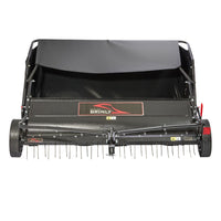 The Brinly Parts 54″ Combo Lawn Sweeper with Dethatcher (LSDT2-54BH-G) features a black canopy, large wheels, and metal tines for effective collecting and tine dethatching, with the Brinly brand displayed prominently on the front.