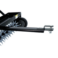 Close-up of Brinly Parts 40″ Tow-Behind Spike Aerator, model SAT2-40BH-G, featuring spiked roller wheels, wide channel tow bar, transport wheels, and an angled hitch arm for vehicle attachment to efficiently aerate lawns by perforating soil.