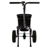 The Brinly Parts 50 LB. Push Spreader with Side Deflector & Hopper Cover (P20-500BHDF-A2) features large wheels, a front-facing handlebar, and a durable hopper—making it an ideal choice for spreading fertilizer on your lawn.