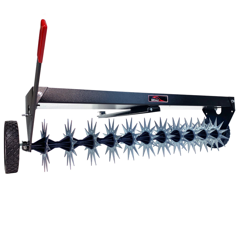 The Brinly Parts 40″ Tow-Behind Spike Aerator (SAT2-40BH-G) features a long metal frame, spiky rotating blades, and a red handle. Its ideal for lawn aeration with its black transport wheel for easy mobility and efficient soil penetration.