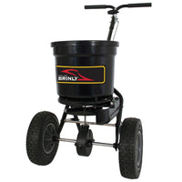 The Brinly Parts 50 LB. Push Spreader with Side Deflector & Hopper Cover (P20-500BHDF-A2) offers large pneumatic wheels, a wide handlebar, and a spacious hopper—perfect for reliable fertilizer or seed spreading.