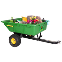 A John Deere 10 cu. Ft. Poly Cart (PCT-100JD/LPPCT10JD) with yellow wheels and 650 lb. capacity is loaded with gardening supplies: a bag of soil, pink-and-yellow potted plant, gloves, and garden tools.