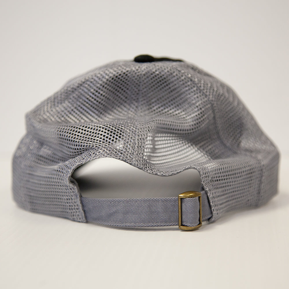 A close-up shows the adjustable strap with brass buckle on the Brinly Parts Gray & Black Baseball Cap, featuring a mesh back, set against a plain white background.