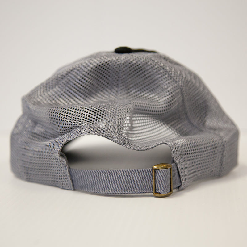 A close-up shows the adjustable strap with brass buckle on the Brinly Parts Gray & Black Baseball Cap, featuring a mesh back, set against a plain white background.