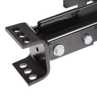 Close-up of a black metal bracket with cylindrical and angular parts, ideal for grading tasks. It includes a bolt, nuts, and multiple adjustment holes, demonstrating industrial craftsmanship similar to the precision-engineered 38” Sleeve Hitch Box Scraper | BS-381BH by Brinly Parts.