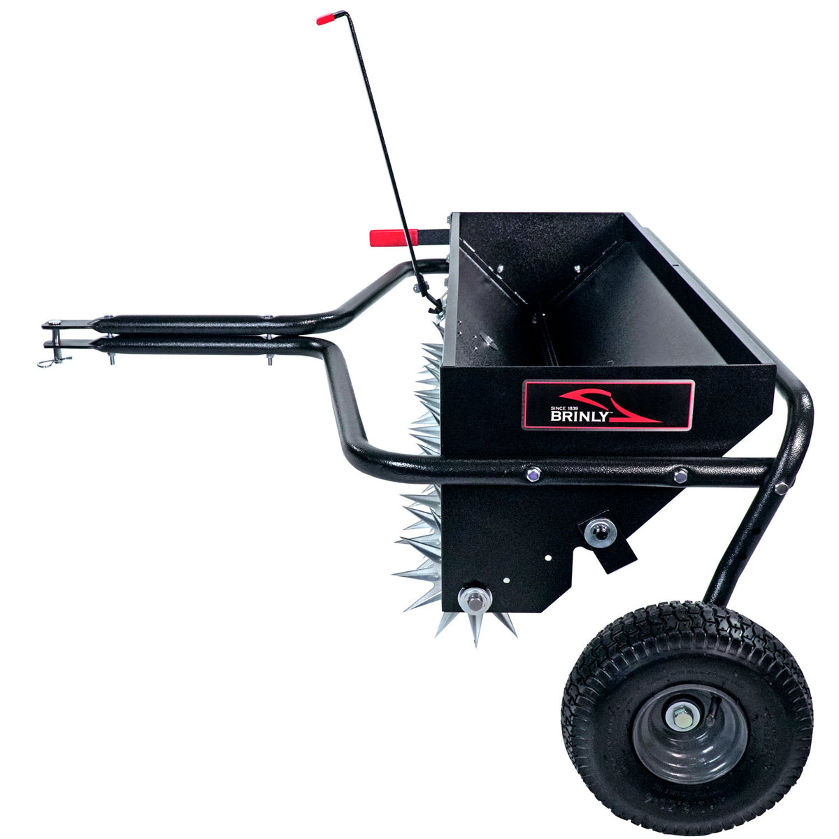 Side view of a Brinly Parts 40 Combination Aerator Spreader (AS2-40BH-G) with pneumatic tires, spiked wheels, handle, and hitch. It includes a rectangular 100 lb. hopper and red accents for towing behind a lawn tractor.