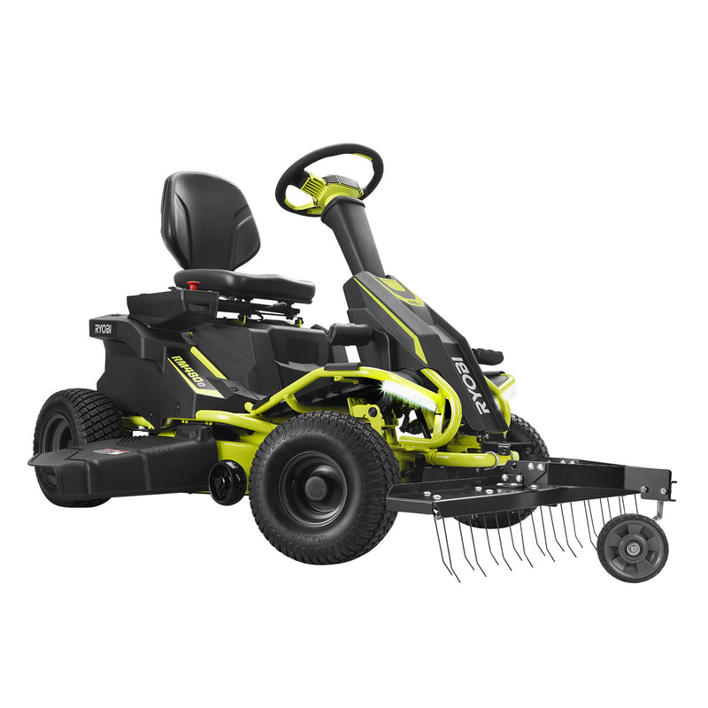 This RYOBI Electric Riding Mower features a cushioned seat and large tires, and comes with the Brinly Parts 38 in. Front Mount Dethatcher (DT-38RY) with metal tines for easy raking or dethatching, all in striking lime green and black.