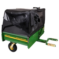 The John Deere MC519 LP49228 Material Collection System is a green cart with a black cover featuring yellow lettering. It has one wheel, a hitch for easy attachment, and is perfect for efficiently collecting grass or leaves due to its impressive hauling capacity.