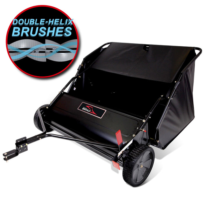 The Brinly Parts 42″ Lawn Sweeper, model LS2-42BH2-G, features a black frame and large wheels with a circular DOUBLE-HELIX Brushes decal. Its open collection bag is designed to handle debris effortlessly.