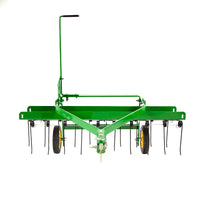 The John Deere 40 Tow-Behind Dethatcher (LPTA40JD/TA-400JD) features yellow wheels, a black handle, and spring tines for lawn dethatching and aeration. It is shown in green on a white background.