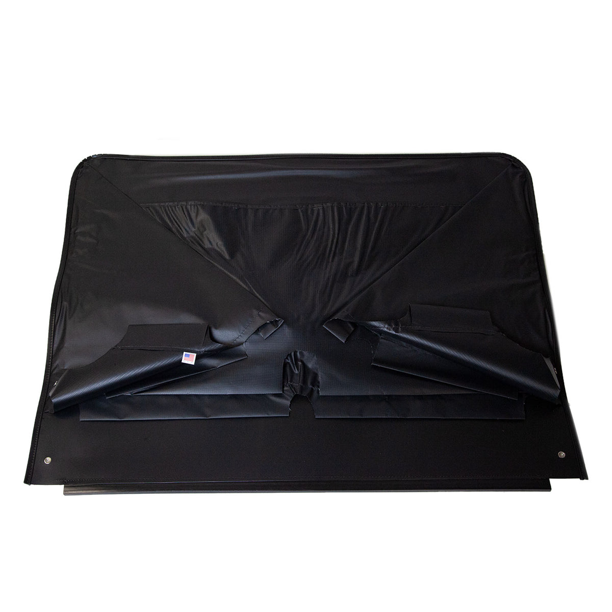 The R-2426 Half-Length Windscreen Kit by Brinly Parts is a black folding cover, ideal for vehicle cargo areas. Its durable material with visible seams and edges offers protection against airborne debris, and it is pictured lying flat against a white background.