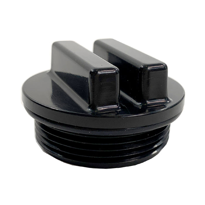 The Brinly Parts Plug Bung Plastic is a black plastic threaded cap with two raised rectangular handles for easy gripping and twisting. It features side grooves for secure attachment to a container or device, offering a functional design for convenience.