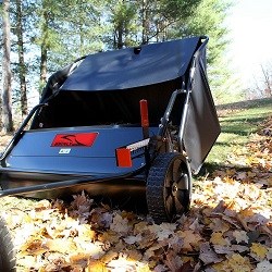 lawn sweeper picking up leaf cover close up